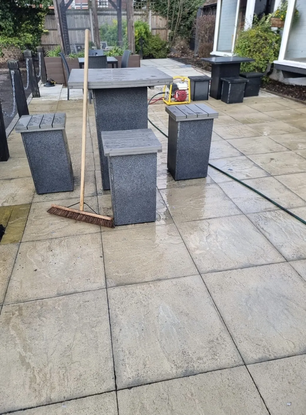 A bunch of trash cans sitting on top of a patio.